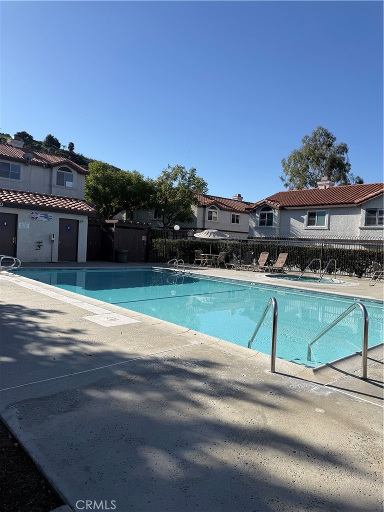 24316 Sylvan Glen Road, Unit G Diamond Bar, CA 91765 - Photo 22 of 23 a view of swimming pool with a yard and plants