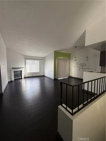 a view of kitchen with furniture and wooden floor
