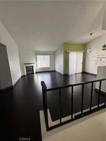 a view of a hallway with windows