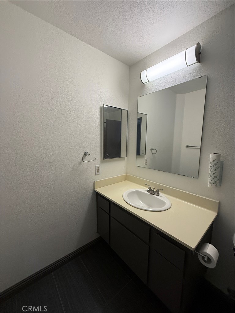 24316 Sylvan Glen Road, Unit G Diamond Bar, CA 91765 - Photo 10 of 23 a bathroom with a sink and a mirror