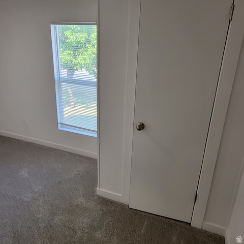 1735 South 1380 West Logan, UT 84321 - Photo 44 of 46 Neutral-toned wall paint and trim, complemented by plush gray carpeting