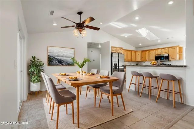 a view of a kitchen with a sink and cabinets
