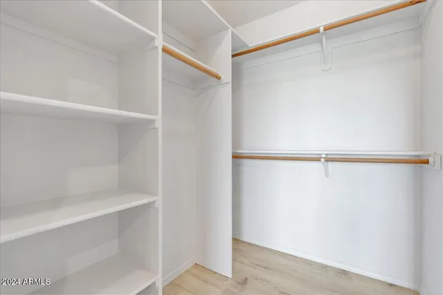a bathroom with a sink vanity and a mirror