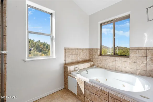 a bathroom with a bathtub and a sink