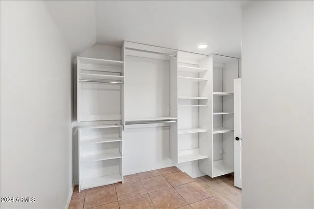 a bathroom with a sink vanity mirror and toilet