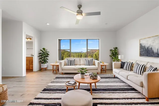 a bathroom with a sink a toilet a mirror and shower