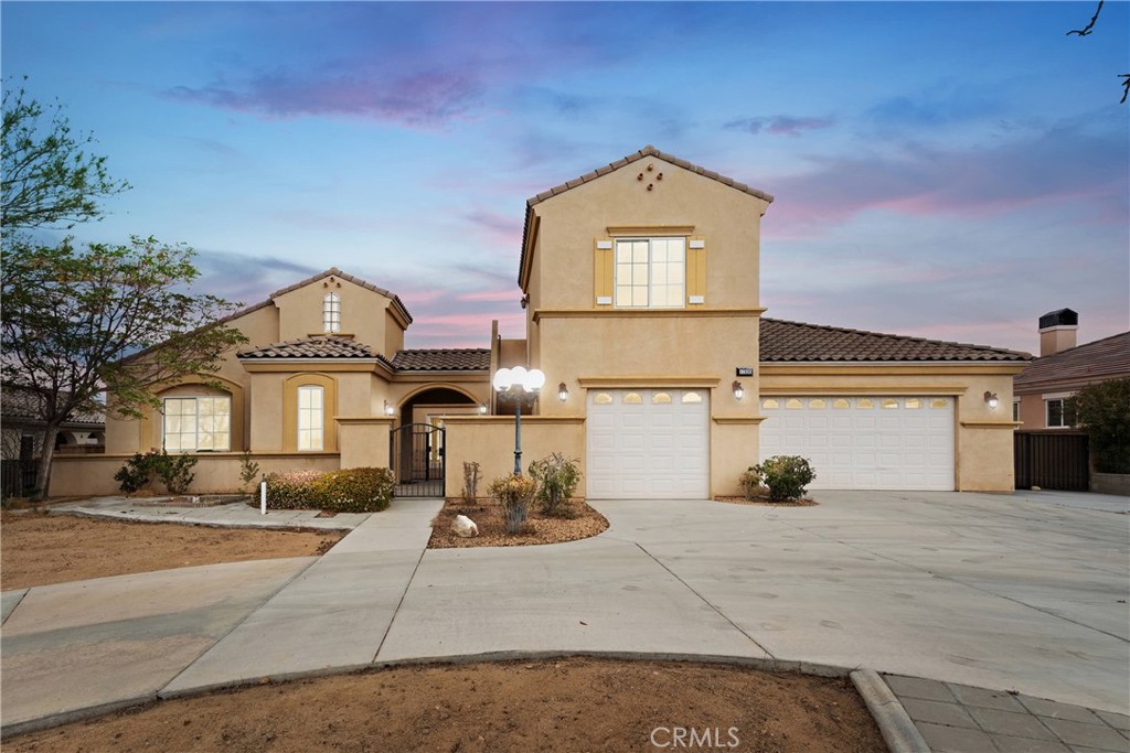 17830 Mana Road Apple Valley, CA 92307 - Photo 1 of 46 a front view of a house with a yard