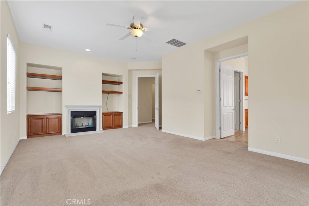 17830 Mana Road Apple Valley, CA 92307 - Photo 24 of 46 a view of empty room with a fireplace