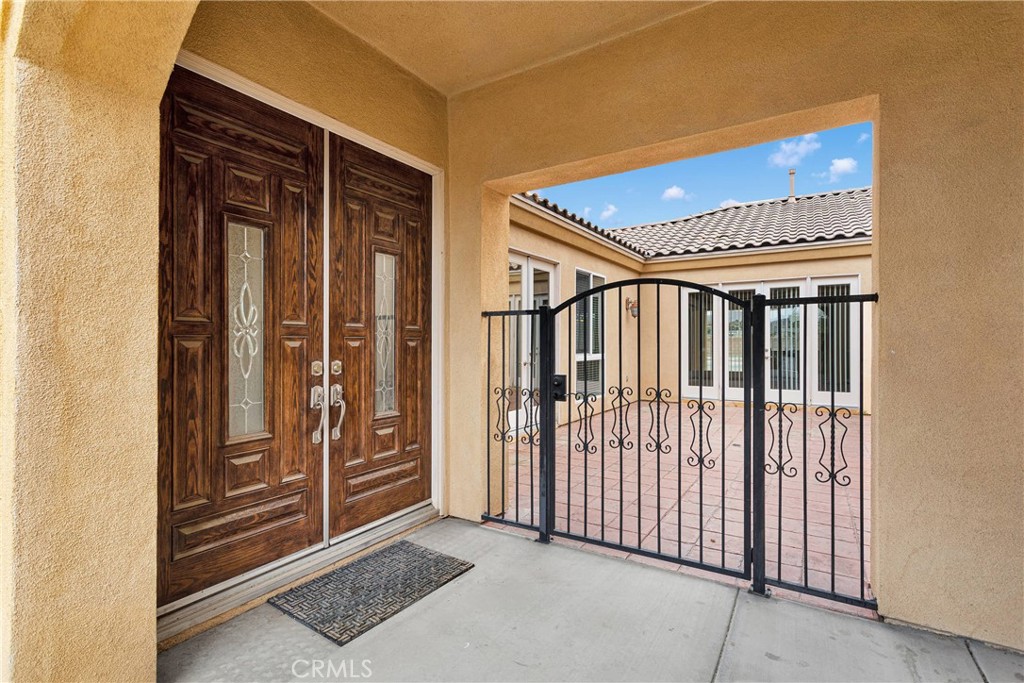 17830 Mana Road Apple Valley, CA 92307 - Photo 41 of 46 a view of a hallway with wooden walls and windows