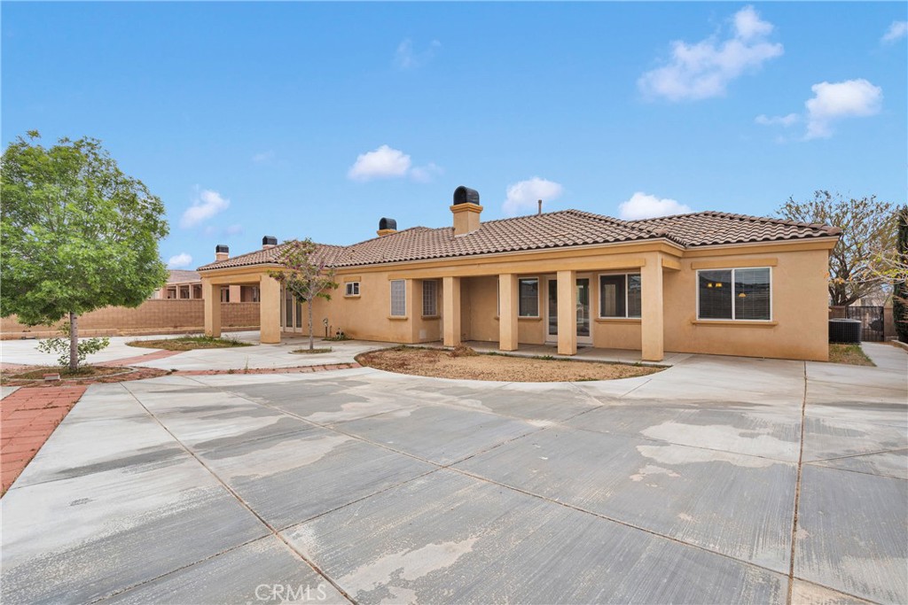 17830 Mana Road Apple Valley, CA 92307 - Photo 43 of 46 a front view of a house with a yard