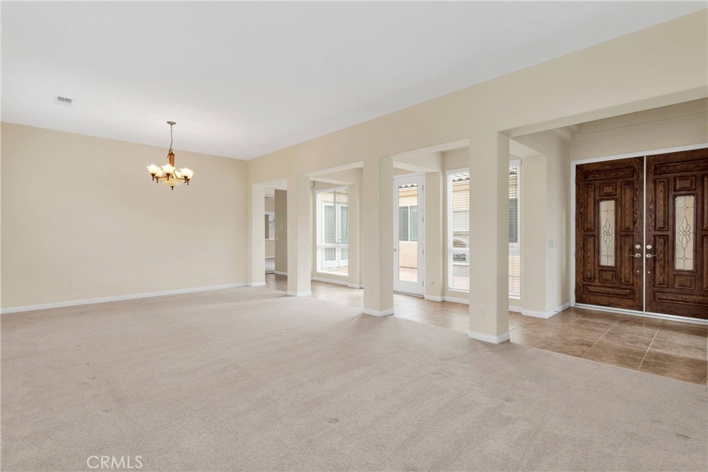 17830 Mana Road Apple Valley, CA 92307 - Photo 5 of 46 en empty room with windows and closet