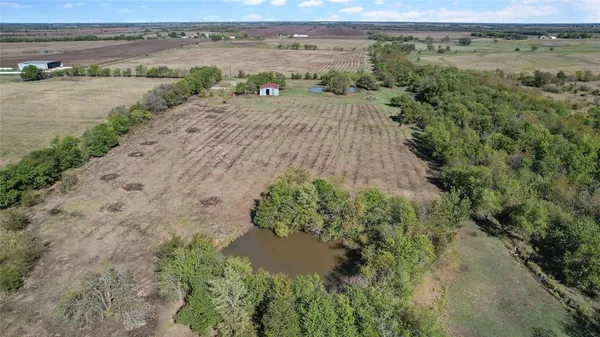 an aerial view of a houses with an outdoor space