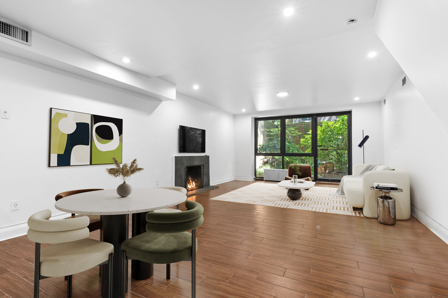 33 West 9th Street Manhattan, NY 10011 - Photo 10 of 15 a living room with furniture and a wooden floor