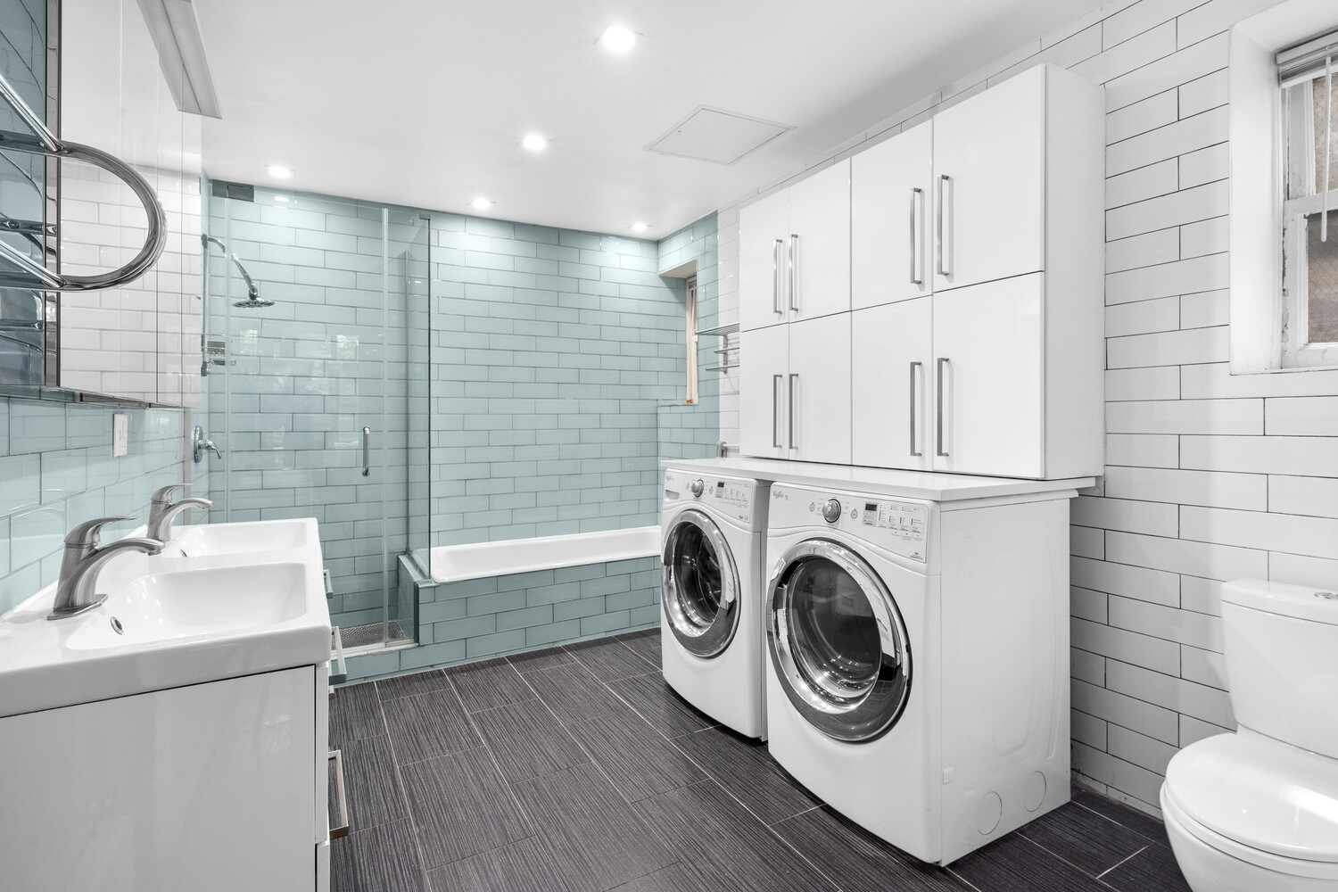 33 West 9th Street Manhattan, NY 10011 - Photo 13 of 15 a utility room with dryer and washer