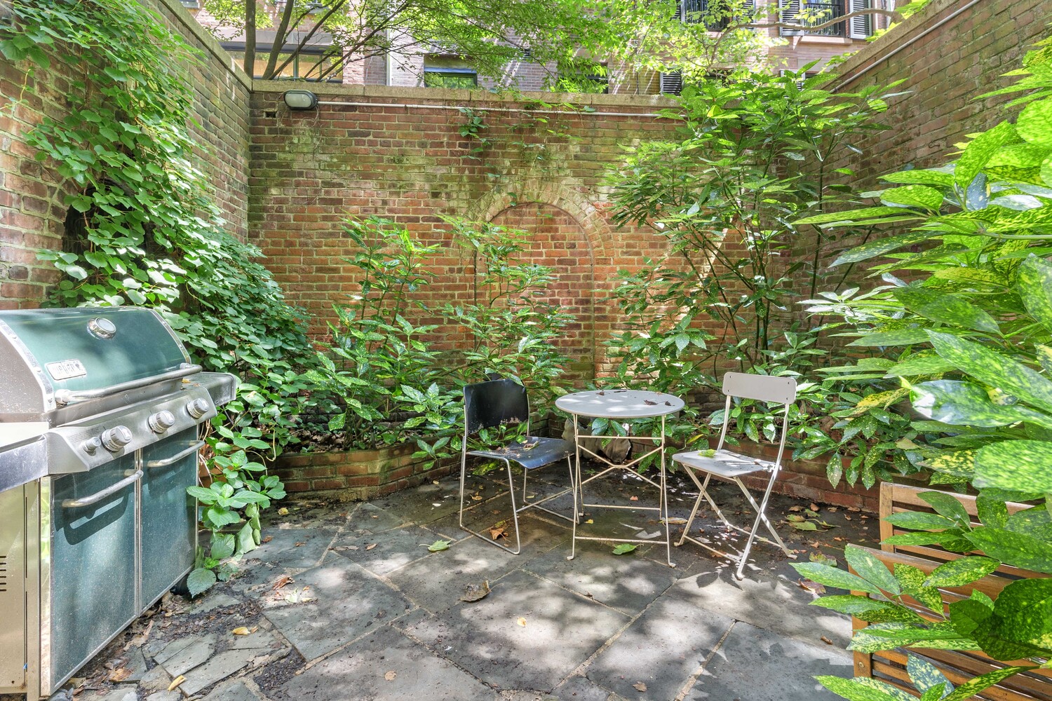 33 West 9th Street Manhattan, NY 10011 - Photo 14 of 15 a view of a backyard with sitting area