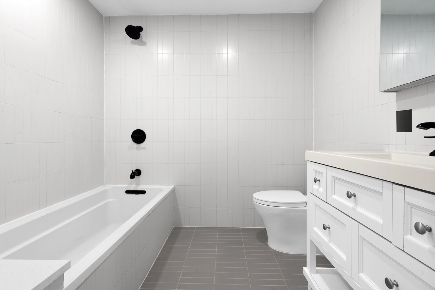 33 West 9th Street Manhattan, NY 10011 - Photo 4 of 15 a bathroom with a sink a toilet and shower