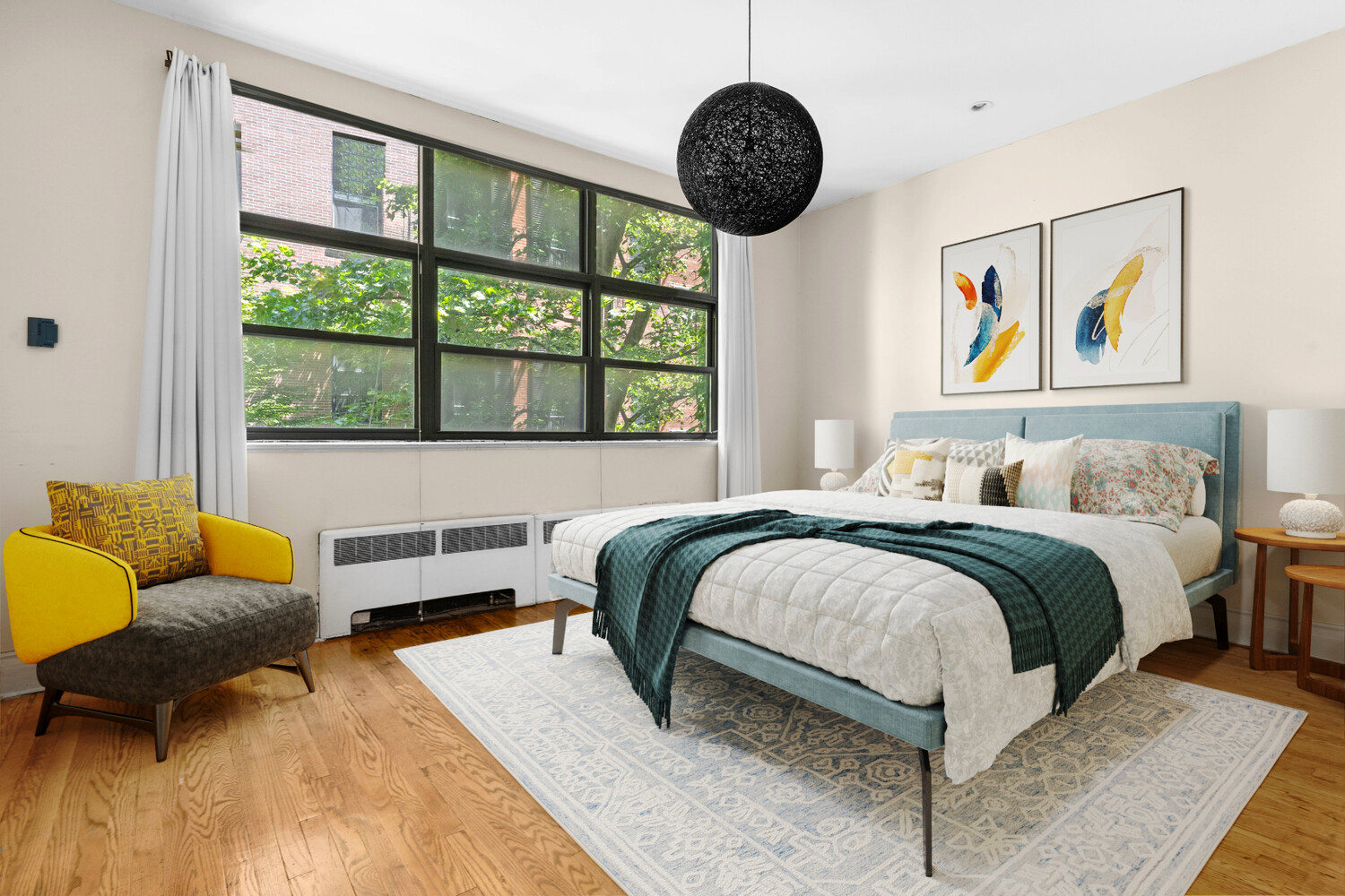 33 West 9th Street Manhattan, NY 10011 - Photo 8 of 15 a bedroom with a bed and wooden floor