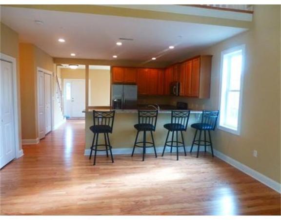 53 Baldwin Road, Unit 1402 Billerica, MA 01821 - Photo 12 of 30 a view of a dining room with furniture window and wooden floor
