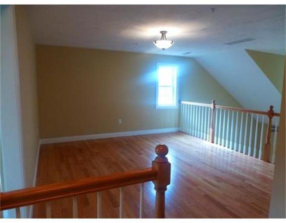 53 Baldwin Road, Unit 1402 Billerica, MA 01821 - Photo 18 of 30 a view of a porch with wooden floor