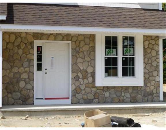 53 Baldwin Road, Unit 1402 Billerica, MA 01821 - Photo 4 of 30 a front view of a house with a yard