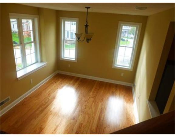 53 Baldwin Road, Unit 1402 Billerica, MA 01821 - Photo 6 of 30 a view of empty room with wooden floor and fan