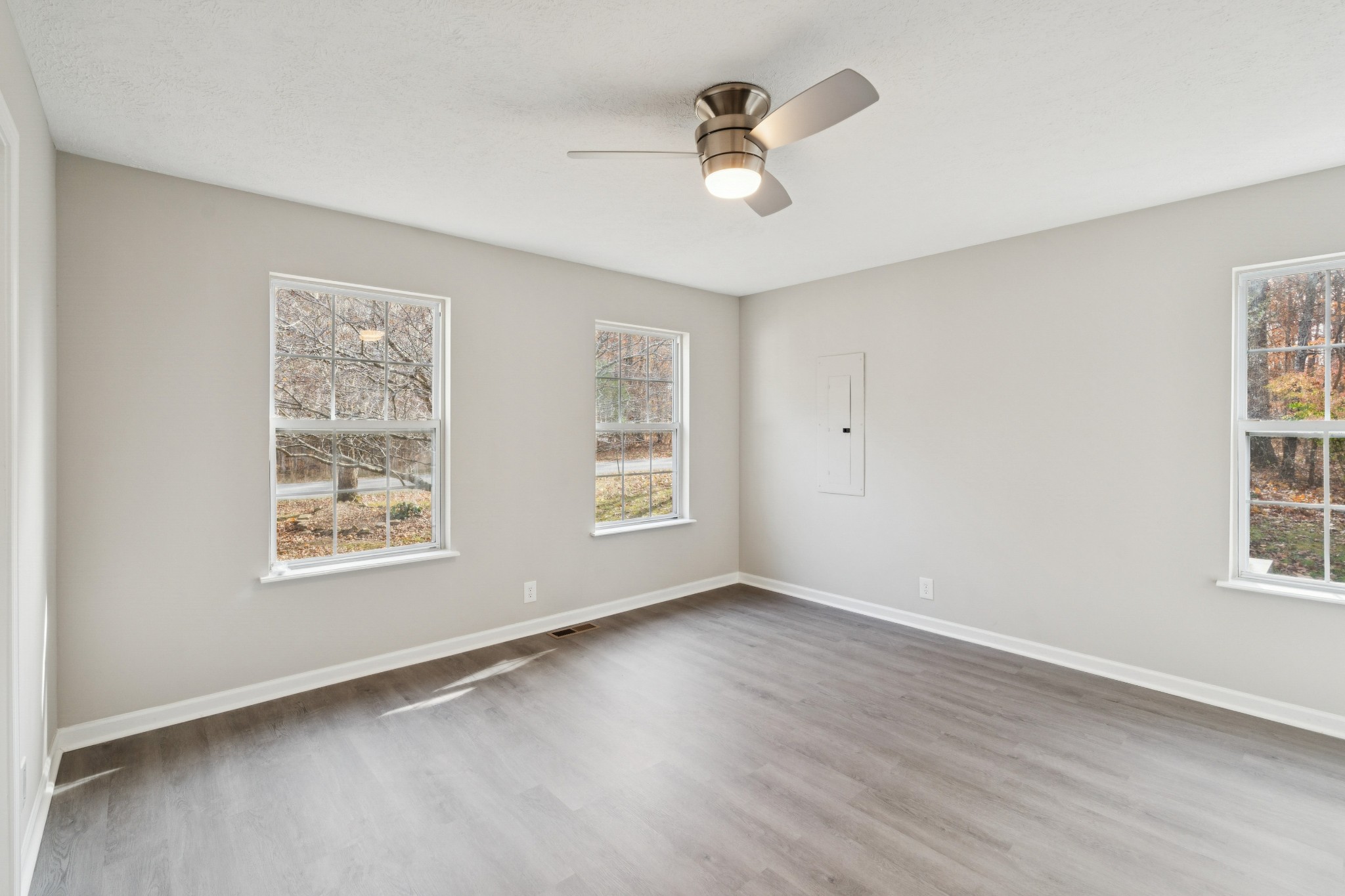163 Monteagle Falls Road Monteagle, TN 37356 - Photo 12 of 35 a view of an empty room with a window and wooden floor