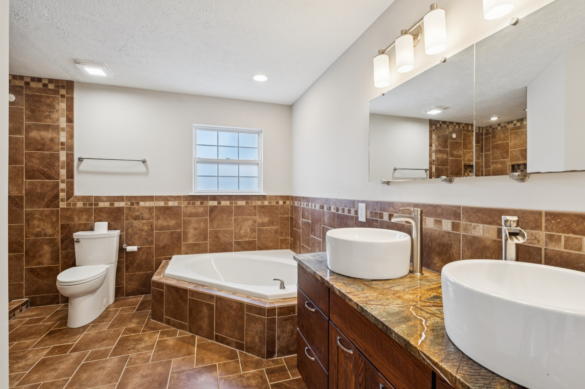 163 Monteagle Falls Road Monteagle, TN 37356 - Photo 14 of 35 a bathroom with a granite countertop sink and a mirror