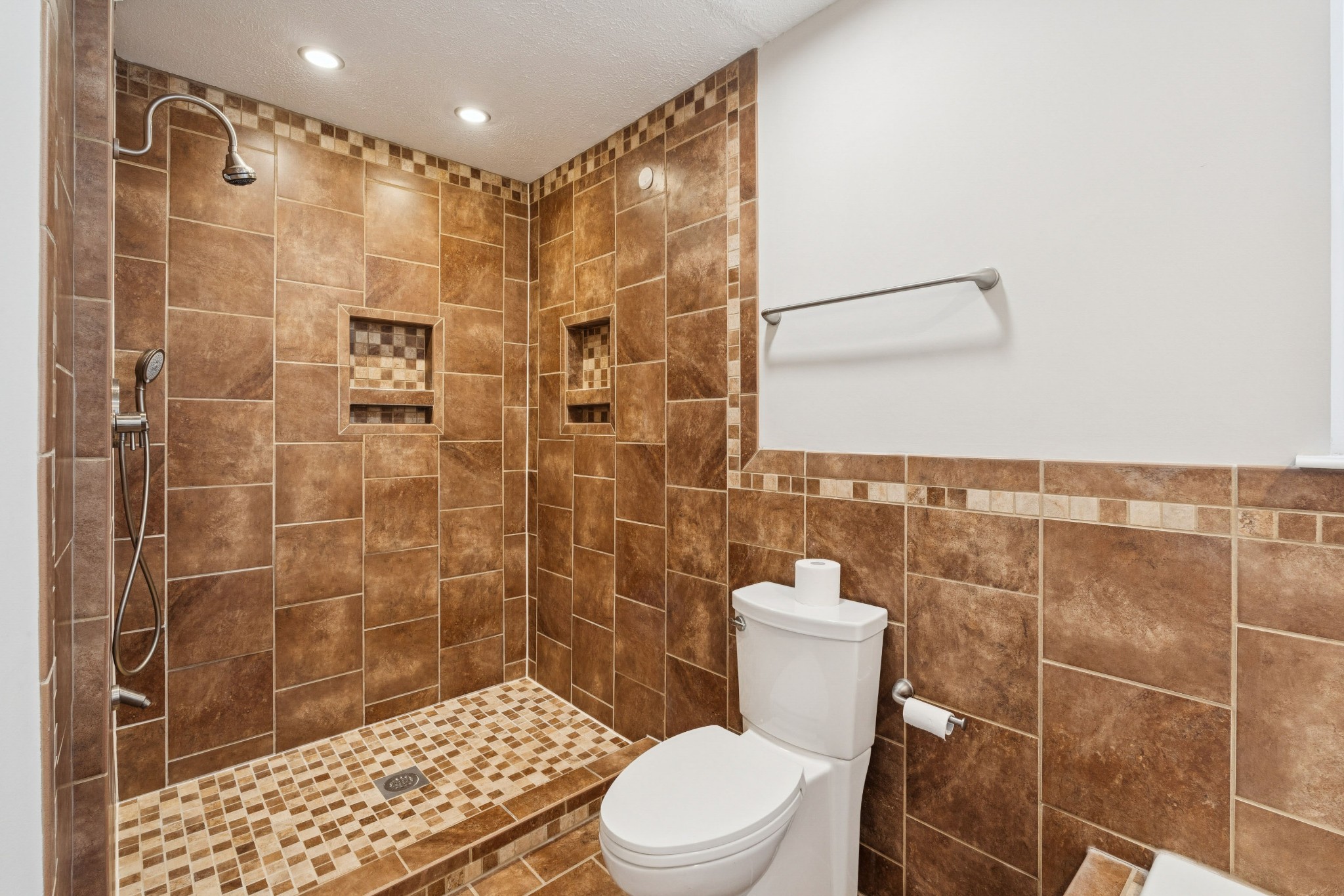 163 Monteagle Falls Road Monteagle, TN 37356 - Photo 15 of 35 a bathroom with a shower a toilet and a sink