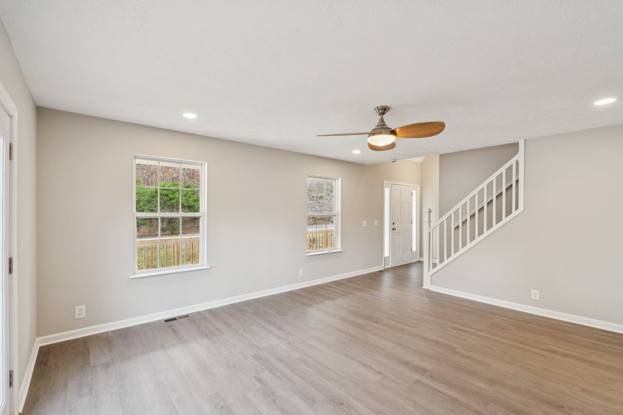 163 Monteagle Falls Road Monteagle, TN 37356 - Photo 16 of 35 a view of an empty room with wooden floor and a window