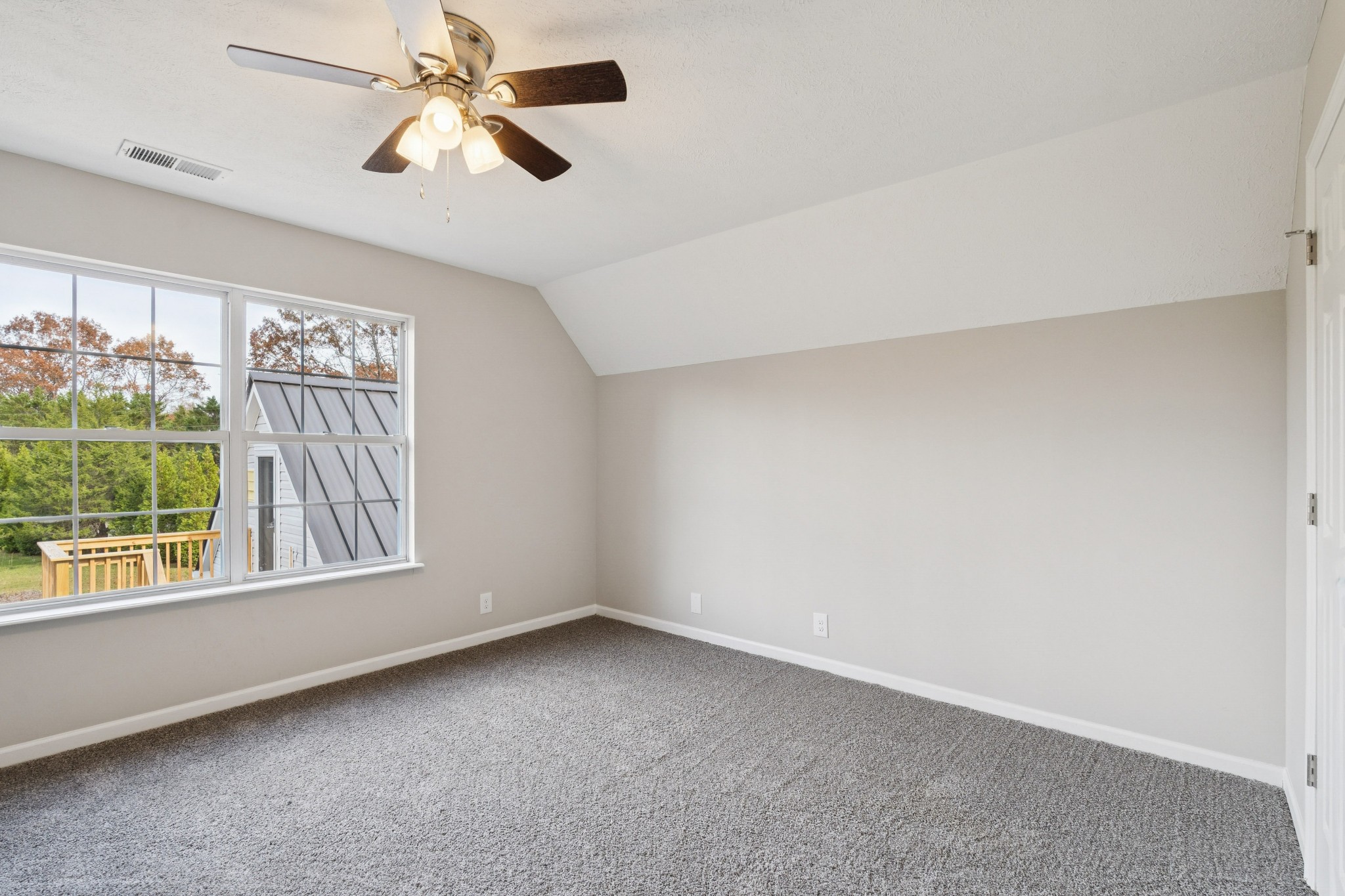 163 Monteagle Falls Road Monteagle, TN 37356 - Photo 17 of 35 an empty room with windows and fan