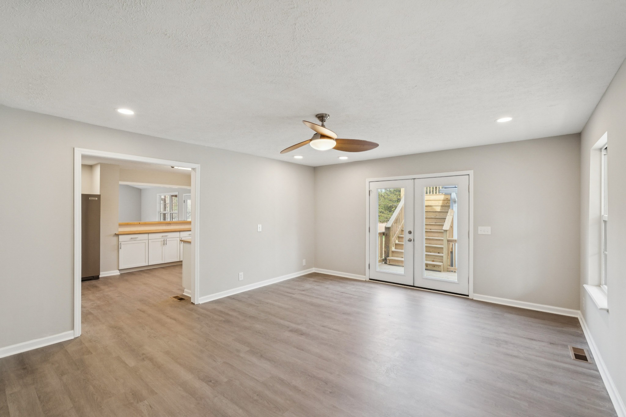 163 Monteagle Falls Road Monteagle, TN 37356 - Photo 3 of 35 wooden floor in an empty room with a window