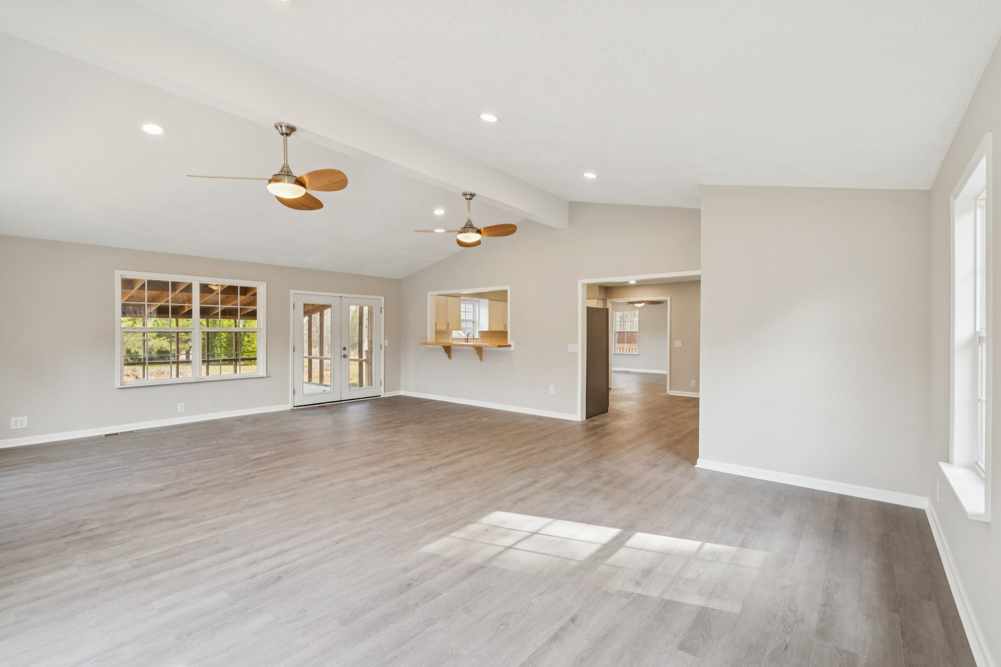 163 Monteagle Falls Road Monteagle, TN 37356 - Photo 8 of 35 an empty room with windows and ceiling fan view