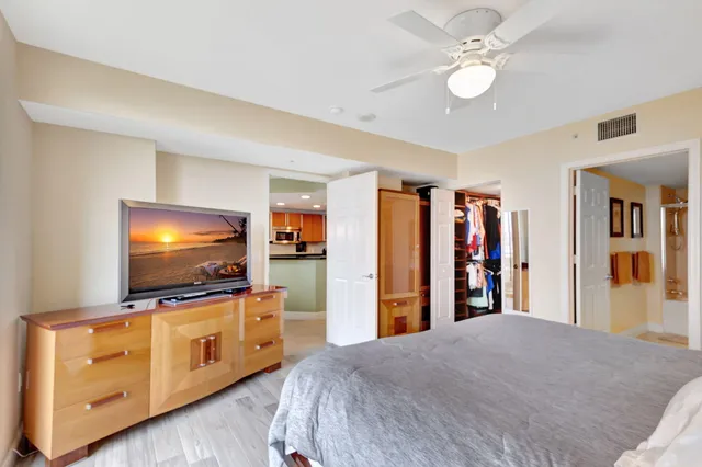 a bedroom with furniture and flat screen tv