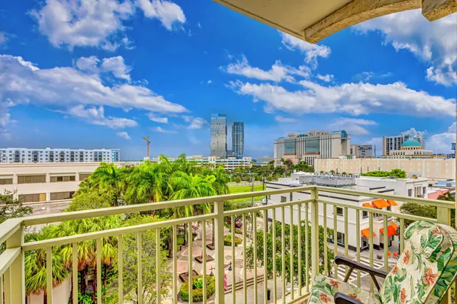 a view of a chairs and table in a balcony