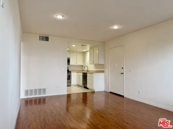 a view of kitchen with wooden floor