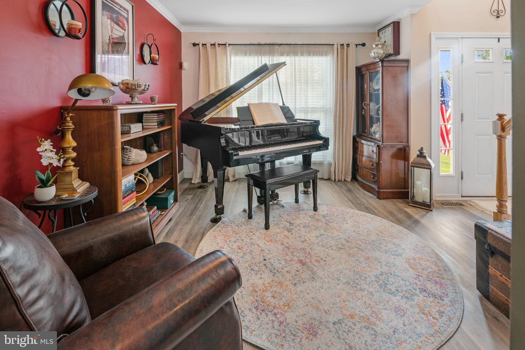 113 Swordfish Road Manahawkin, NJ 08050 - Photo 22 of 51 a living room with furniture a piano and a flat screen tv