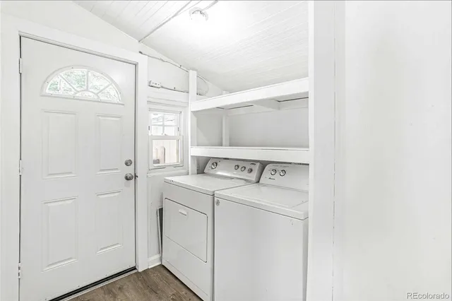 a kitchen with stainless steel appliances a refrigerator a stove top oven a sink and cabinets