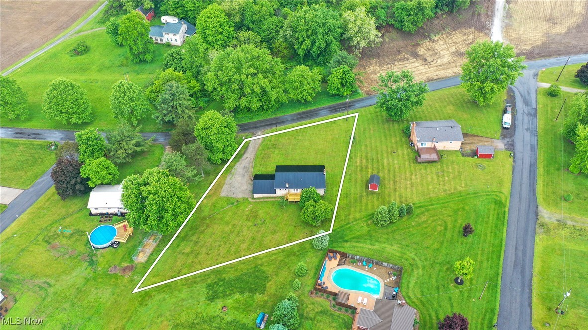 23595 Sandy Creek Road Minerva, OH 44657 - Photo 31 of 32 Aerial view of property and surrounding area with a pool area and property parcel outlined