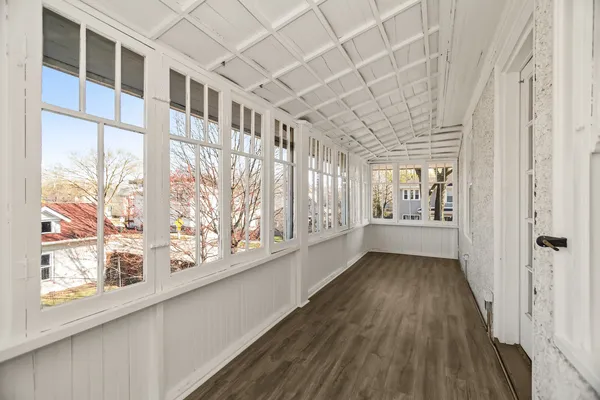 a view of an entryway with wooden floor