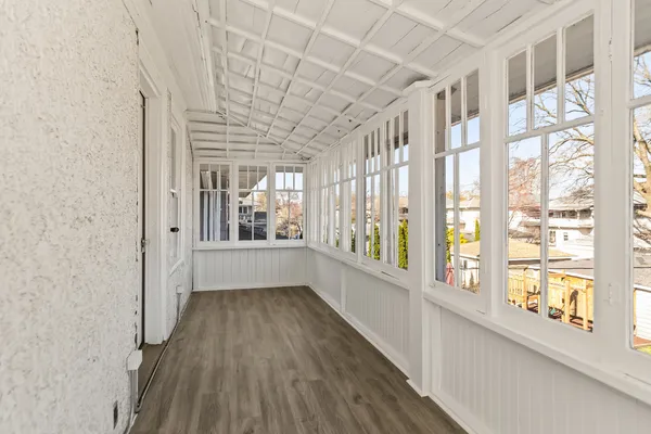 a view of an entryway with wooden floor