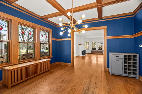a view of an entryway with wooden floor
