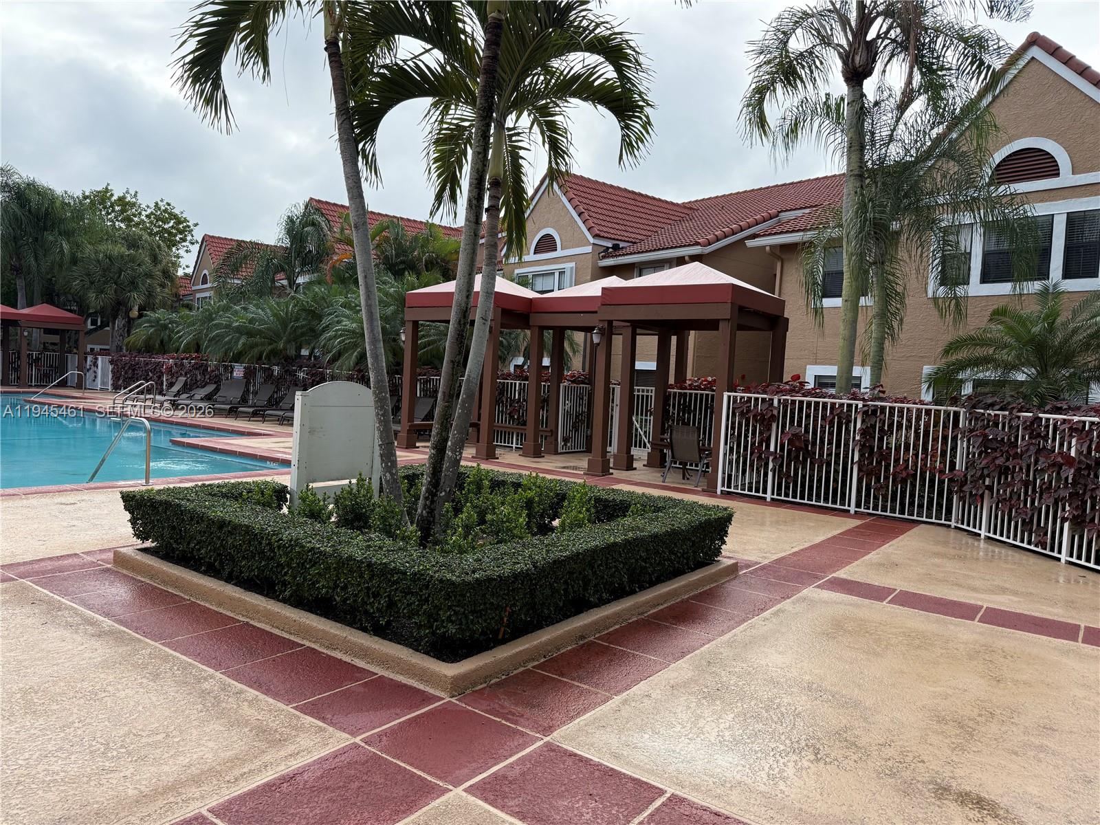 10441 Southwest 156th Court, Unit 429 Miami, FL 33196 - Photo 15 of 17 a view of a house with backyard and sitting area