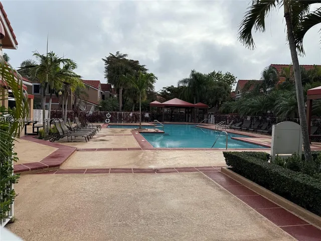 a view of a yard with cars