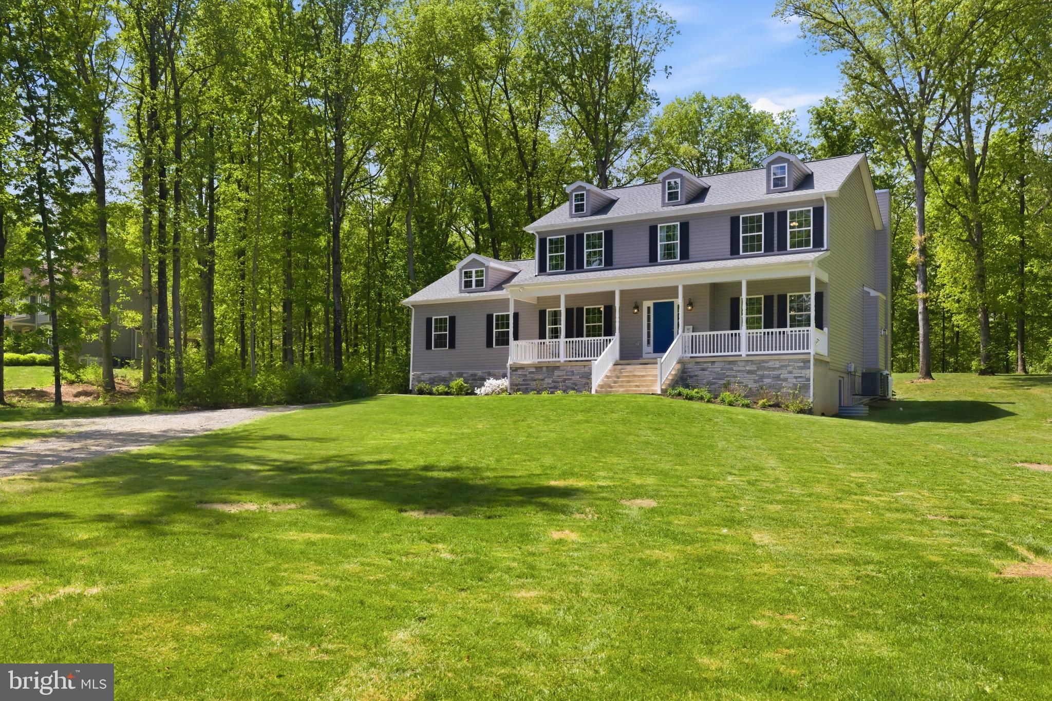 6324 Vint Hill Road Warrenton, VA 20187 - Photo 1 of 103 a view of a house with a big yard and large trees