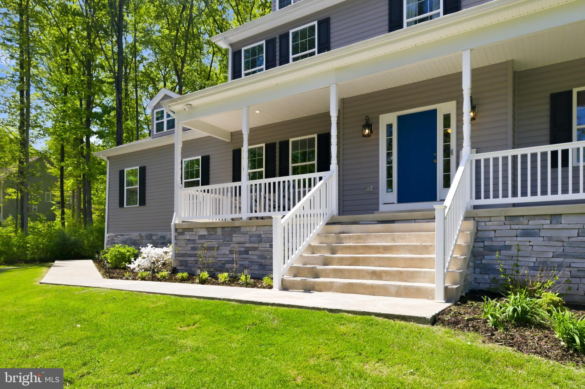 6324 Vint Hill Road Warrenton, VA 20187 - Photo 11 of 103 a front view of a house with a garden