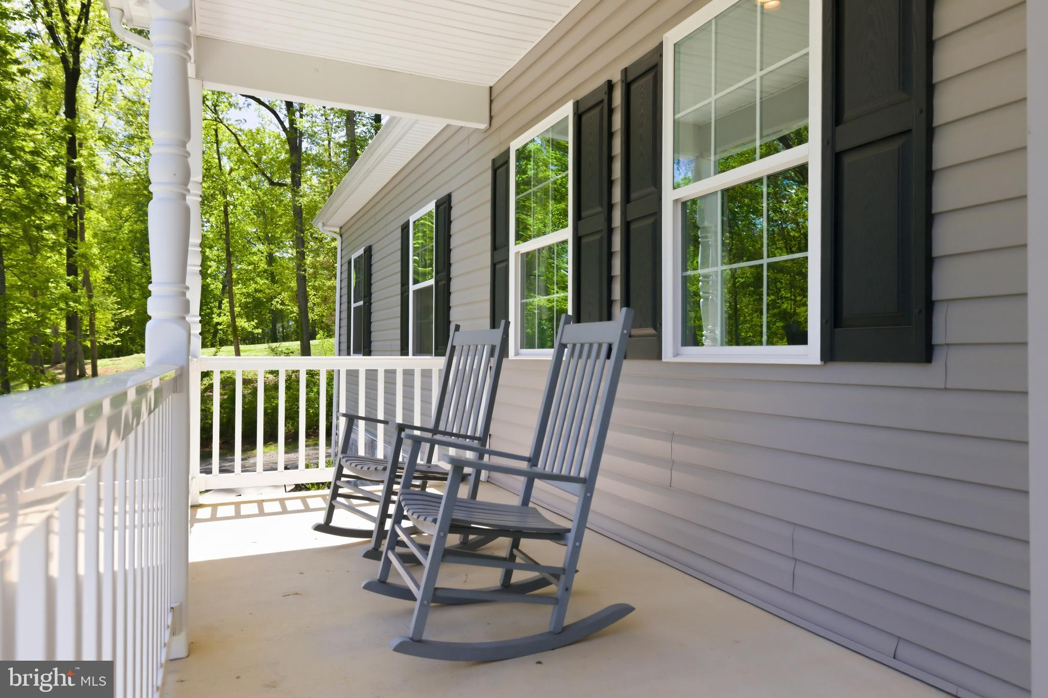 6324 Vint Hill Road Warrenton, VA 20187 - Photo 12 of 103 a view of a chairs and table in the balcony