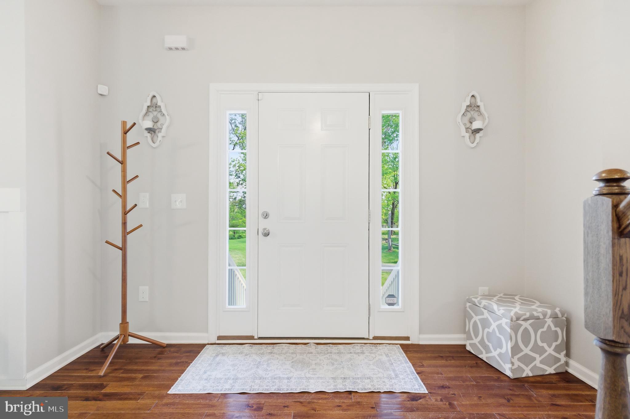 6324 Vint Hill Road Warrenton, VA 20187 - Photo 14 of 103 a view of an entryway with wooden floor and door