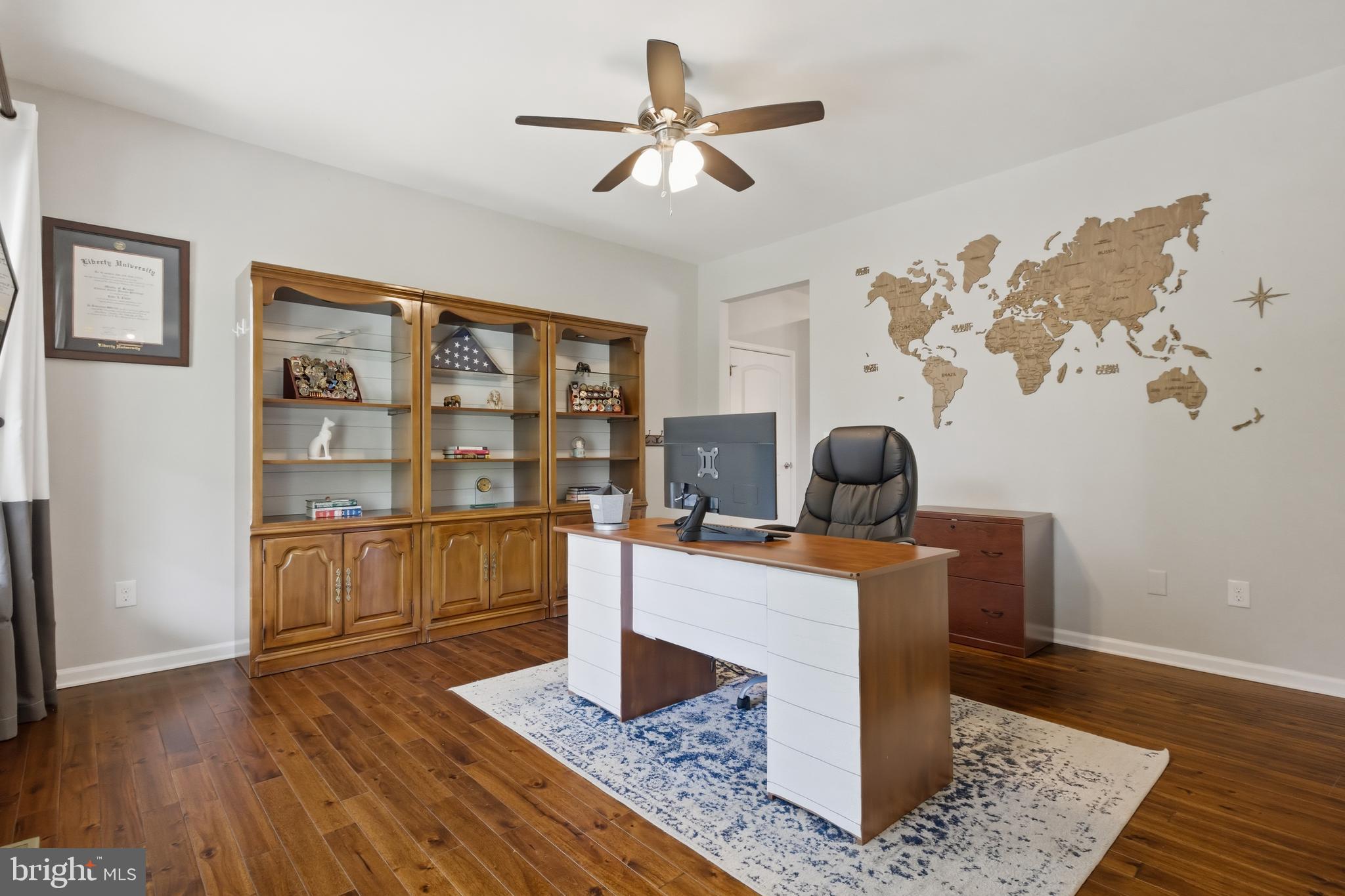 6324 Vint Hill Road Warrenton, VA 20187 - Photo 17 of 103 a living room with hard wood floors and a rug