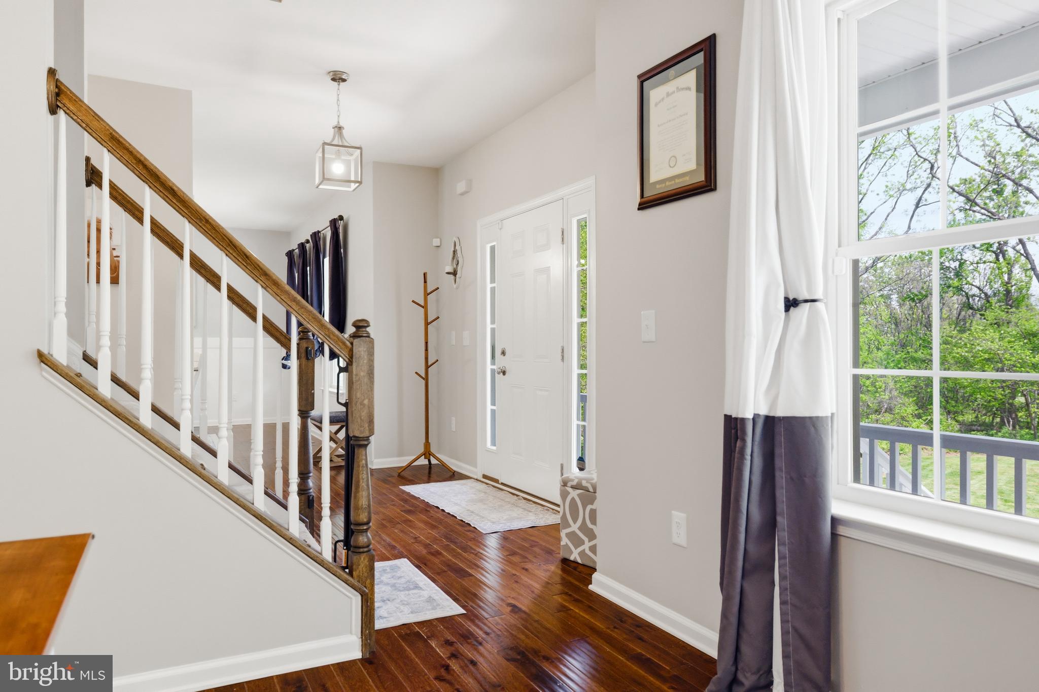 6324 Vint Hill Road Warrenton, VA 20187 - Photo 19 of 103 a view of an entryway with wooden floor and door