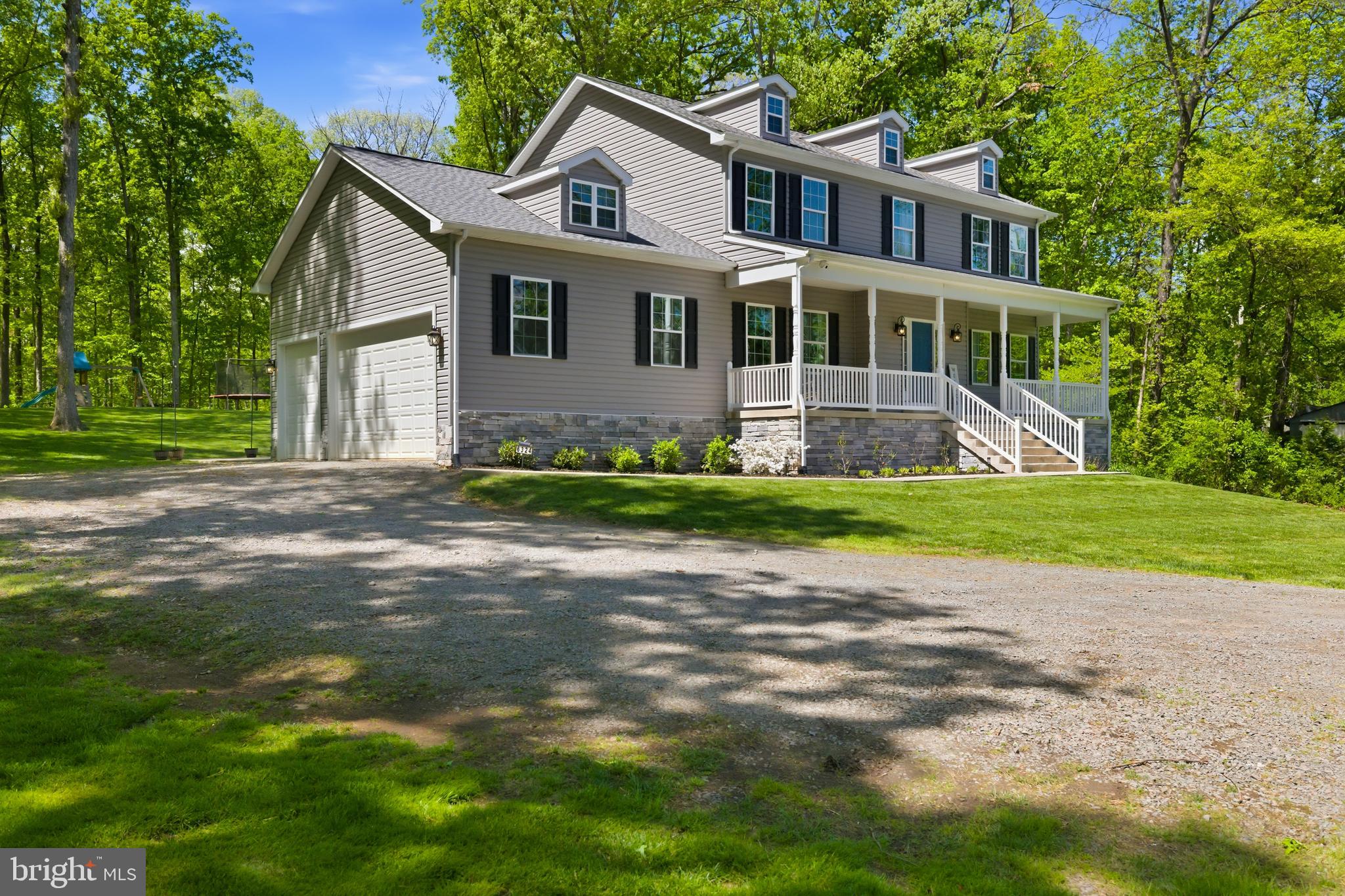 6324 Vint Hill Road Warrenton, VA 20187 - Photo 2 of 103 a front view of a house with a yard and garage